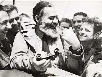 (ERNEST HEMINGWAY) A file from Wide World Pictures with about 100 photographs retracing Hemingway’s personal and professional life.